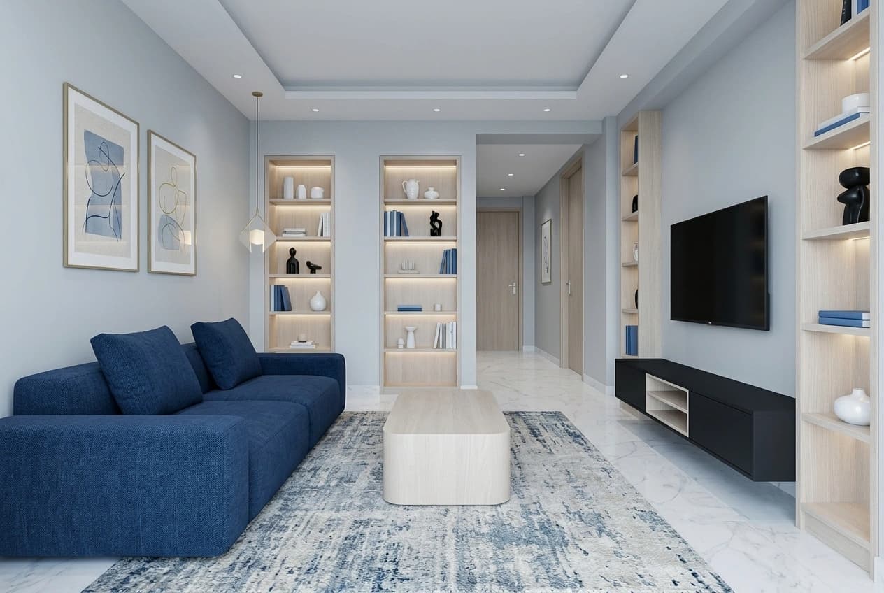 A living room with built-in display niches lit from within, a wall-hung media unit and tall shelving returning along the adjacent wall.